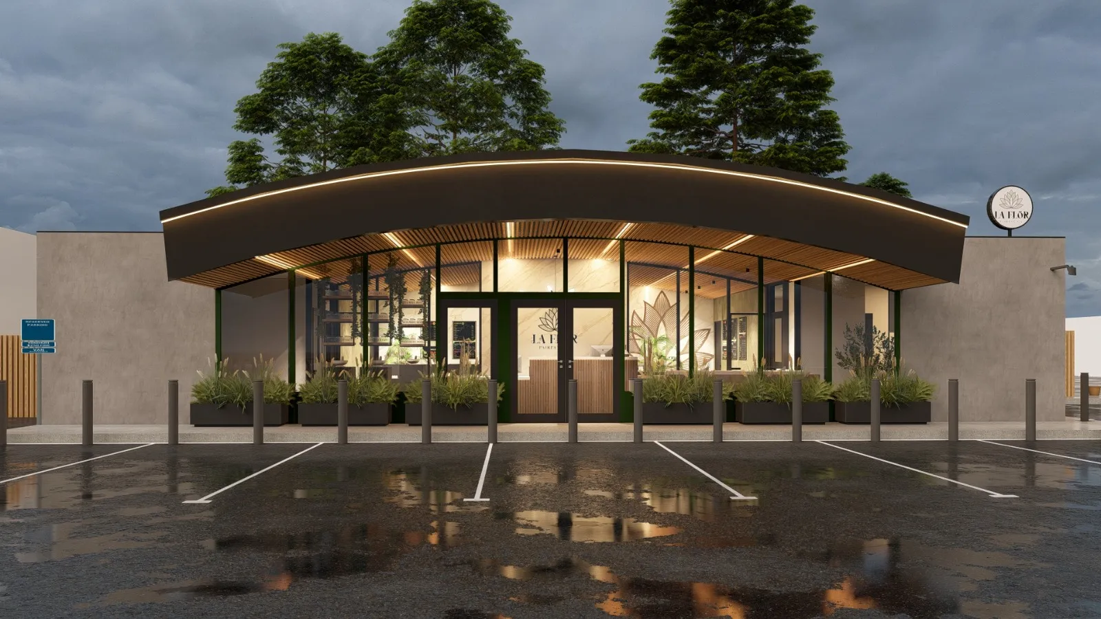 The La Flōr storefront at dusk on Sir Francis Drake Boulevard in Fairfax, its curved black canopy and warm wood ceiling lit from within, framed by redwoods.